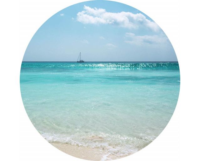 Horizont am Meer mit einem Sonnenuntergang auf einem exotischen Wandkreis.