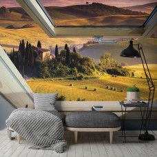 Eine Fototapete mit einer Landschaft und Blick durch ein Dachfenster, ideal für das Schlafzimmer und das Wohnzimmer.