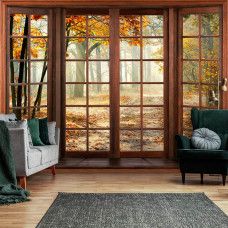 Eine Fototapete mit einem bunten Herbstwald, gedruckt auf Vliestapete, geeignet für ein Wohnzimmer.