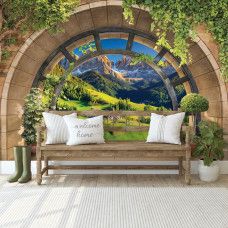 Eine Fototapete mit einer malerischen Berglandschaft in Tirol, perfekt für ein Büro.