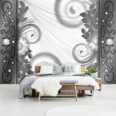 Eine Fototapete mit künstlerischen abstrakten Formen und Blumen in einem Schlafzimmer.