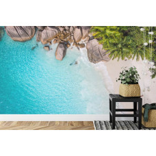 Eine inspirierende Fototapete mit einem tropischen Strand und Sonne, ideal für ein Büro.