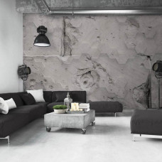 Eine Fototapete mit Beton-Sechsecken für einen industriellen Look im Wohnzimmer.
