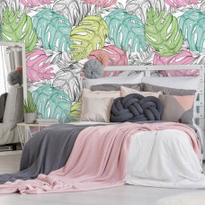 Eine Fototapete mit Blättern in Pastellfarben für das Kinderzimmer.