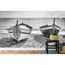 Eine Fototapete mit einem beruhigenden Blick auf einen Strand mit kleinen Booten, perfekt für eine Küche.