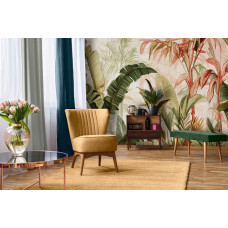 Eine Fototapete mit botanischen Dschungelblättern auf Beton in einem natürlichen Design, geeignet für ein Wohnzimmer.