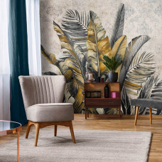Eine Fototapete mit botanischen Dschungelblättern, geeignet für ein Wohnzimmer.