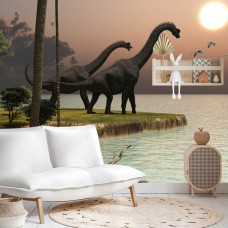 eine Fototapete mit einem verspielten Design von Dinosauriern an einem Teich, die in einem Babyzimmer angezeigt wird.