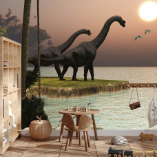 eine Fototapete mit einer farbenfrohen Landschaft von Dinosauriern, die in einem Jungenzimmer angezeigt wird.