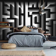 Eine Fototapete mit einem schwarz-weißen Labyrinth in einem abstrakten Design, geeignet für das Schlafzimmer.