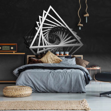 Fototapete im Kinderzimmer mit verspielten Dreiecken in 3D-Optik auf dunklem Hintergrund, die dem Raum Tiefe verleihen.