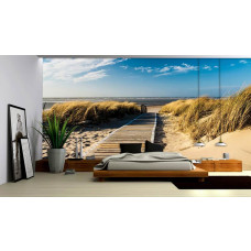 Eine Fototapete mit Dünen und Strand mit Meerblick, geeignet für ein Schlafzimmer.