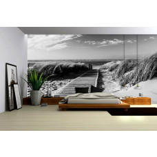 Eine Fototapete mit einer schwarz-weißen Dünenlandschaft, ideal für ein Schlafzimmer.