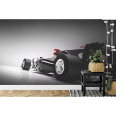 Eine Fototapete eines dynamischen Formel-1-Autos, das Geschwindigkeit ausstrahlt, in einem Kinderzimmer.