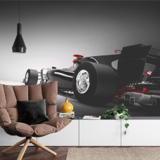 Eine Fototapete eines dynamischen Formel-1-Autos mit kraftvollen Linien in einem Wohnzimmer.