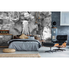 Eine Fototapete mit einem in graue Felsen geschnitzten Elefanten, geeignet für ein Kinderzimmer.