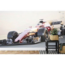 Eine Fototapete mit einem Ferrari Formel 1 Auto bei Höchstgeschwindigkeit in einem aufregenden Kinderzimmer.