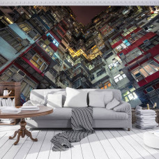 Eine Fototapete von einem Mehrfamilienhaus in einer Stadt für das Wohnzimmer.