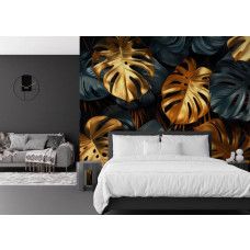 Fototapete mit luxuriösem Jungle Design und goldenen Monstera Blättern im Schlafzimmer.
