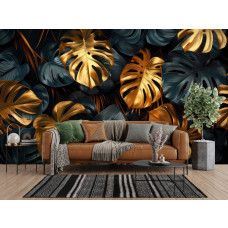 Fototapete mit goldenen Monstera Blättern und Jungle Optik im Wohnzimmer.