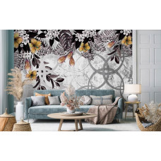 Eine verschnörkelte Fototapete mit goldenen Pflanzen auf einer Betonwand, gesehen im Wohnzimmer.