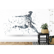 Eine Fototapete mit einer grafischen Darstellung eines Fußballers in Aktion in einem Kinderzimmer.