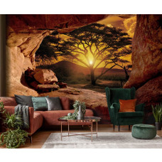 Eine Fototapete mit Blick auf einen Sonnenuntergang aus einer Höhle im Wohnzimmer.
