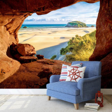 Fototapete einer Höhle mit Blick auf den Strand und die Dünen im Wohnzimmer.
