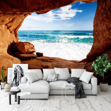 Ein 3D-Effekt Fototapete einer Höhle mit Blick auf das Meer für das Wohnzimmer.