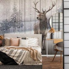 Eine Fototapete mit einem Hirsch in einem Winterwald mit einem Rentier in einer natürlichen Umgebung, zu sehen im Schlafzimmer.