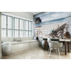 Eine Fototapete von einem Strandweg, der zum Meer führt, sichtbar in einem Wohnzimmer.