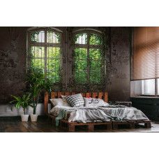 Eine Fototapete mit einem Industriegebäude und Pflanzen, perfekt für ein Schlafzimmer.