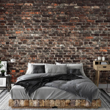 Eine Fototapete mit einer industriellen Steinwand im urbanen Stil im Vliesbehangstil für ein Schlafzimmer.