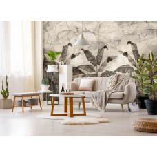 Eine Fototapete mit Dschungelpflanzen und Blättern an einer Betonwand, ideal für ein Wohnzimmer.