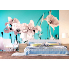 Eine Fototapete mit Mohnblumen in einem Schlafzimmer.