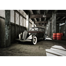 Fototapete mit einem Oldtimer in einer alten Garage, Thema Vintage.