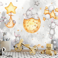 Eine Fototapete mit Häschen in den Wolken mit Sternen und Mond auf Vliestapete im Kinderzimmer.