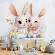Eine Fototapete mit süßen Häschen in einem niedlichen Mädchenzimmer.