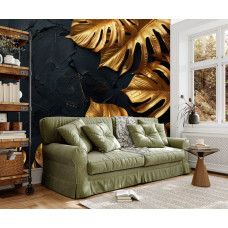 Fototapete mit goldfarbenen Blättern und dunklem Strukturhintergrund im Wohnzimmer.