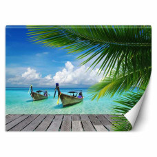 Fototapete mit tropischen strandpalmen in grünen Tönen.