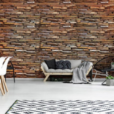 Eine Fototapete von einer modernen Steinwand im industriellen Stil im Wohnzimmer.