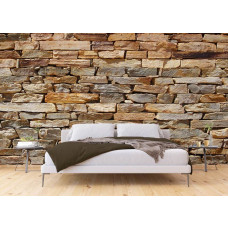 Eine moderne Fototapete mit einer Steinwand in Grautönen, die ein industrielles und zeitgenössisches Gefühl in einem Schlafzimmer erzeugt.