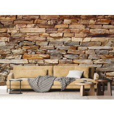 Eine moderne Fototapete mit einer Steinwand in Grautönen, die einen robusten Look in einem Wohnzimmer erzeugt.