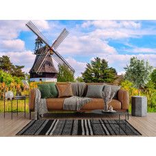 Fototapete Mühle im Frühling im Wohnzimmer mit frischer und natürlicher Ausstrahlung.