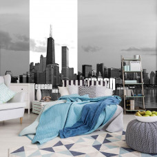 Eine Fototapete einer städtischen Skyline von New York und Chicago, platziert in einem Schlafzimmer.