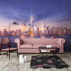 Eine Fototapete von New York in der Nacht mit Wolkenkratzern für den Wohnraum.