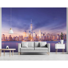 Eine Fototapete von New York in der Nacht mit Wolkenkratzern für das Wohnzimmer.