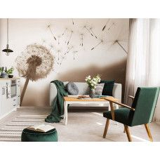 Eine Fototapete mit einer Pusteblume im Wind in Sepia in einem Wohnzimmer.