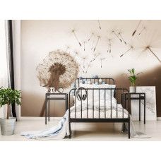 Eine Fototapete mit einer Pusteblume im Wind in Sepia in einem Kinderzimmer.