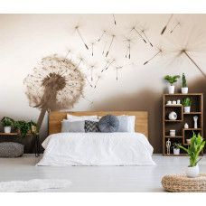 Eine Fototapete mit einer Pusteblume im Wind in Sepia in einem Schlafzimmer.